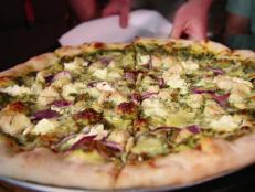 <p>Follow Guy&rsquo;s lead and satisfy your pizza cravings at Pinky G&rsquo;s. Guy savors the Funky Chicken, which is smothered in basil pesto and topped with marinated chicken breasts, ricotta, red onions, artichoke hearts and mozzarella. Another must-try is The Abe Froman: Spicy sausage is the star of this pie.</p>