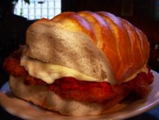 At Big Jim's in "The Run," diners rarely leave hungry. The signature veal Parmesan sandwich nearly matches the width of Guy's head, which Guy deemed "ridiculous." The hefty portion sizes don't end there. Big Jim's calzone packs a punch with ham, salami, capocollo, pepperoni, provolone and veggies.