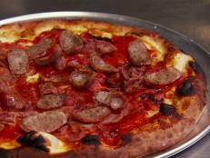 <p>A father-son operation, the duo churns out delicious pizzas and Italian favorites. Guy couldn't keep his hands off of the Italian Stallion, a pizza loaded with sopressata, Parma prosciutto, Italian sausage, and pepperoni. Still hungry? Try the baked spaghetti pie topped with fresh mozzarella.</p>