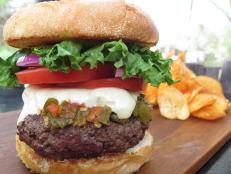 <p>The Santa Fe Bite offers a tantalizing take on the green chile cheeseburger, an iconic menu item in New Mexico. This version starts with a 10-ounce patty of chuck and sirloin, punches it up with a green chile sauce packing just the right amount of heat and pairs it with a tasty, homemade bun.</p>