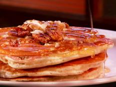 <p>On Triple D, Guy stops by The Brownstone Diner for a big bite of breakfast. Luckily, Brownstone does not disappoint, with 31 varieties of pancakes and its own take on a breakfast burrito made with a pancake for a wrap. After breakfast hours, Guy recommends the signature Greek moussaka.</p>