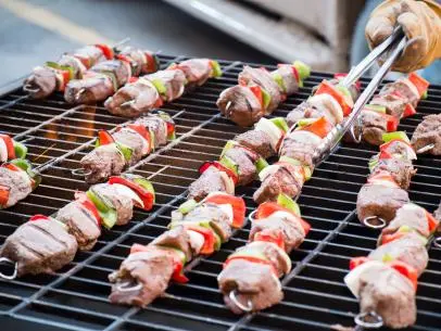 Ladd Drummond grills Christmas Kabobs at the Cowboy Christmas Hoedown in the new building as seen on Food Networkâ  s Pioneer Woman: Cowboy Christmas, Special.