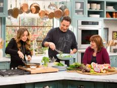 Co-hosts Jeff Mauro and Marcela Valladolid on set with Katherine Alford, Senior Vice President of Culinary at Food Network, as seen on Food Networkâ  s The Kitchen, Season 4.