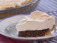 Trisha Yearwood's old-fashioned Southern-style Chocolate Pie recipe combines classic chocolate pudding filling with an airy meringue, all piled high into a Graham cracker crust.