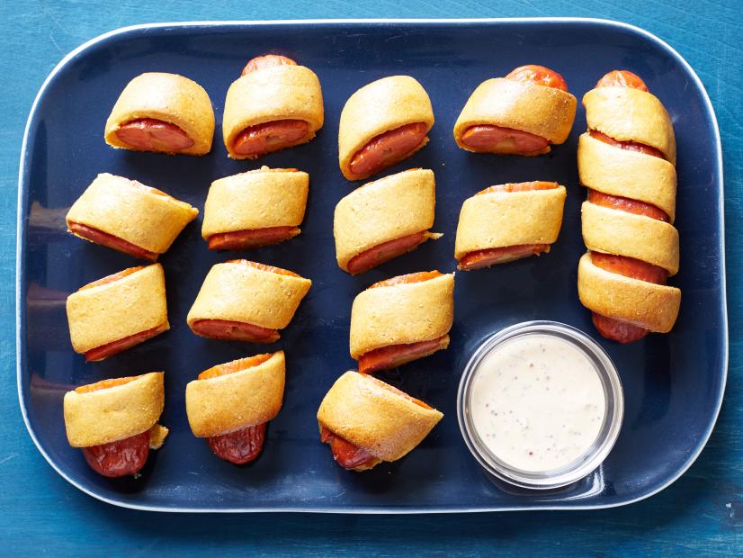Food Network Kitchen's Cajun Cornmeal and Andouille Pigs in a Blanket, as seen on Food Network.
