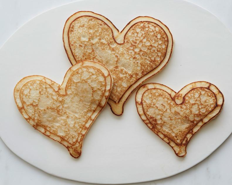 FNK HEARTSHAPED FOODS FOR VALENTINE’S DAY HEART SHAPED FOODS FOR VALENTINE’S DAY, Food Network Kitchen, Food Network, Eggs, Bacon, Pancakes, Shrimp, Cheese, Pepperoni, Pork Chops, Cinnamon, Strawberries, Rice Cereal