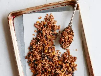 FNK OATMEAL RAISIN COOKIE GRANOLA Food Network Kitchen Food Network Unsalted Butter, Light Brown Sugar, Maple Syrup, Vanilla Extract, Cinnamon, Nutmeg, Rolled Oats, Raisins, Golden Raisins