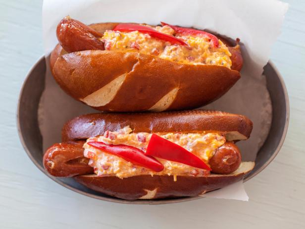 All beef jumbo hot dogs on pretzel bun topped with pimento cheese spread and fresh red pepper slices. Ideas and photos by Jackie Alpers for Food Network.com