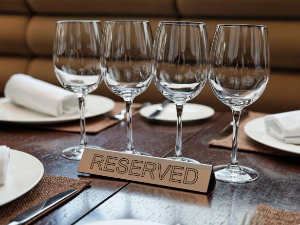 Reserved plate on an arranged table Show Up for Your Reservation at This Hong Kong Hot Spot, or You Will Pay — a Lot