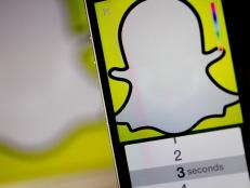 The Snapchat Inc. application (app) is displayed for a photograph on an Apple Inc. iPhone 5s in Washington, D.C., U.S., on Wednesday, Feb. 18, 2015. Snapchat Inc. is raising money that could value the company at as much as $19 billion. Photographer: Andrew Harrer/Bloomberg via Getty Images