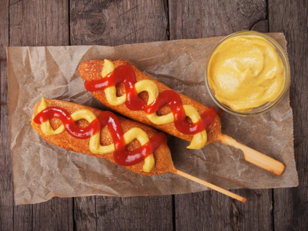 Home made corn dogs with ketchup and mustard, classic american food