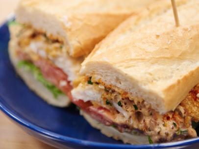 Finalist Alex McCoy's dish, July 4th: Cornmeal Crusted Catfish Po’ Boy with Celeriac Remoulade and Heirloom Tomato, for the Star Challenge, Food Stars at Home for the Holidays, as seen on Food Network Star, Season 11.