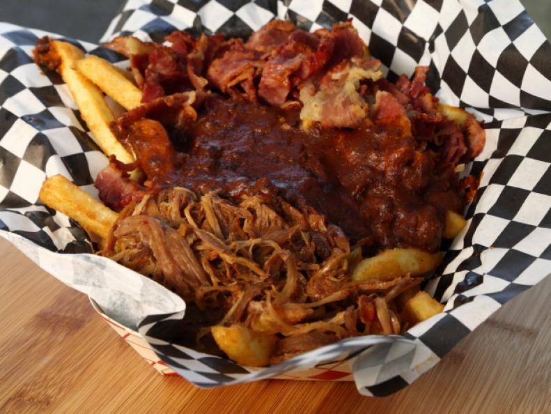 This dish called Dirty Fries, is a meat lover's delight because of the delicious layers of sweet pork, pastrami, and pastrami Reuben all smothering cheese and french fries, as seen on Food Network's Carnival Cravings with Anthony Anderson, Season 1.
