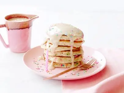 FNK BIRTHDAY PANCAKES
Food Network Kitchen
Food Network
Heavy Cream, Maple Syrup, Cream Cheese, Vanilla Extract, Kosher Salt, Allpurpose
Flour,
Sugar, Baking Powder, Fine Salt, Milk, Unsalted Butter, Confetti Sprinkles, Eggs, Whipped
Cream