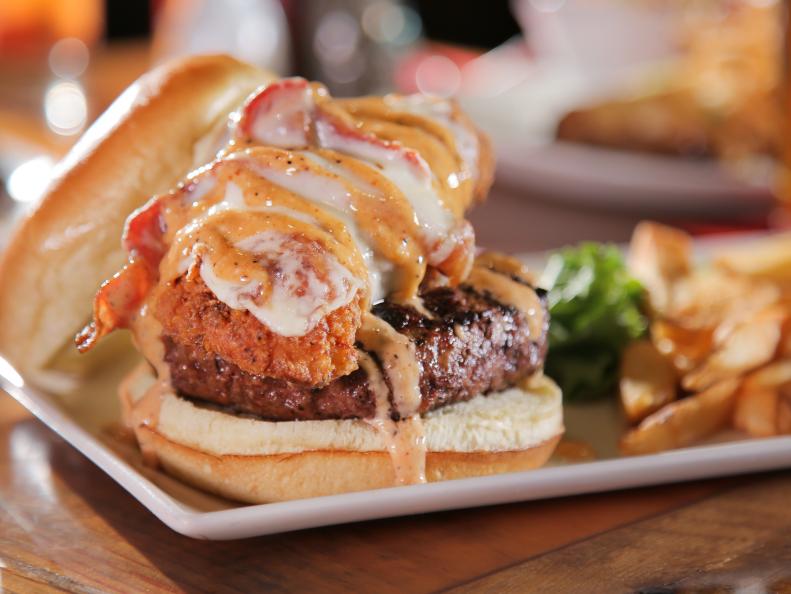 The Whole Tuckin' Farm burger as served at Tuckaway Tavern in Raymond, NH as seen on Food Network's Diners, Drive-Ins and Dives episode 2509.