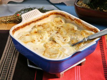 Sunny Anderson's Scalloped Sage Potatoes dish is displayed, as seen on Food Network's The Kitchen, Season 11.