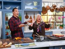 Guest Nancy Fuller demonstrates her Root Vegetable One Dish recipe for host Jeff Mauro, as seen on Food Network's The Kitchen, Season 11.