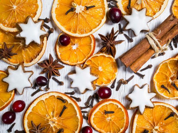 christmas background with gingerbreads, fruits and spices