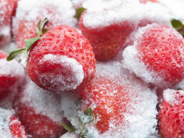 Frozen strawberries closeup. Detailed cold fruit image. soft focus