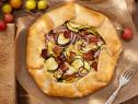 Food Network Kitchen’s Summer Squash and Bacon Galette as seen on Food Network.
