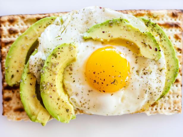 Matzoh avocado toast with egg, herbs and salt