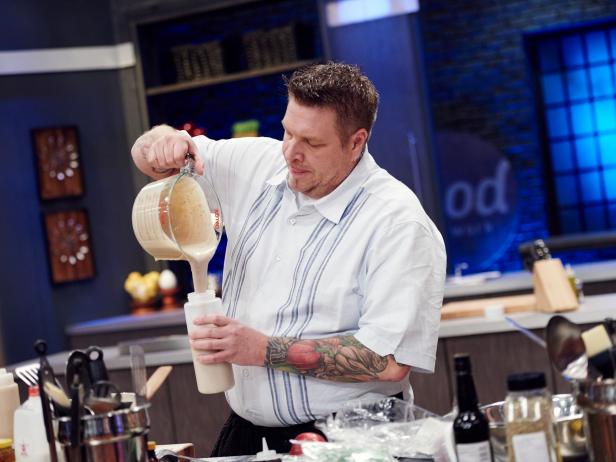Contestant Rob Burmeister preparing his dish, Cold Hearted Cake, for the Mentor Challenge, The Name Game, as seen on Food Network Star, Season 12.