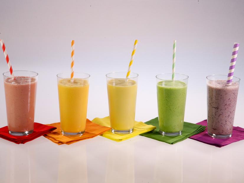 Rainbow smoothies are displayed during an episode about rainbow foods to brighten your day, as seen on Food Network's The Kitchen Sink, Season 1.