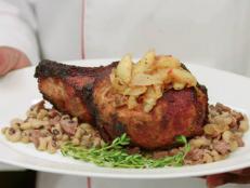Chef-Owner Carlos Swepson uses his French culinary training to riff on soul food staples. The mouthwatering results include the Double Cut Pork Chop. For this signature dish, a 20-ounce pork chop is rubbed with a spicy-sweet mixture and seared to seal in the meat’s natural flavor. The chop is roasted until tender, then smothered with a sauteed onion-and-apple mixture and nestled on a bed of rich black-eyed peas.