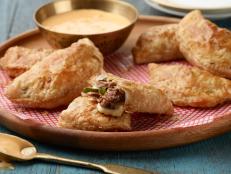 These flaky empanadas are filled with all the fixin's of Philly's famous cheesesteaks. A spicy cheese sauce for dipping on the side is the winning touch -- or you can skip it depending on which whiz camp you're in.