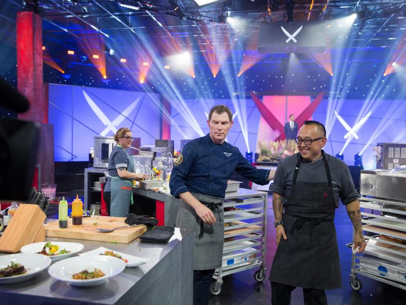 Iron Chef Bobby Flay (L) and contestant Tory Miller, during the Iron Chef Challenge, with secret ingredient Bisson, as seen on Iron Chef Showdown, Season 1.