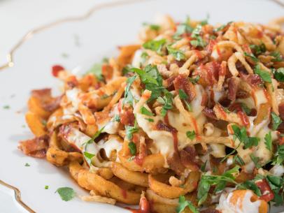 Beauty shot of loaded curly fry nacho, as seen on Food Network’s Trisha’s Southern Kitchen Season 11