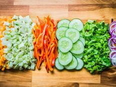 Some pieces of vegetables on a wood table