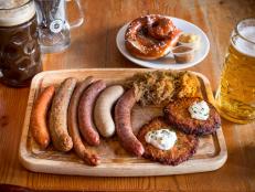 <p>For a taste of Germany in Philadelphia, locals head to this beer hall to indulge in sausages, pretzels and other satisfying bites, along with suds from Andechs and other breweries based in the fatherland. So popular are the housemade sausages that Brauhaus Schmitz makes between 500 and 600 pounds’ worth per week, with six different options available on the menu. Michael Symon favors the ungarischewurst, a Hungarian sausage laced with smoked garlic and paprika. “That’s delicious; it’s so balanced,” he said.</p>