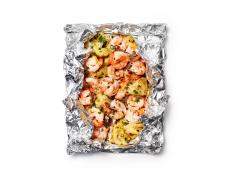 Looking for an easy yet tasty recipe for summer or camping trip? Try Food Network's Lemon Shrimp Scampi with Artichokes over the grill or a campfire.