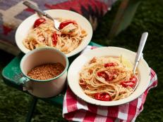 You can make a campfire seafood pasta with minimal provisions. All it takes is a few cans, some dry spaghetti and garlic-lemon butter (that you made back at home). Once the water comes to a boil the dish comes together quickly, so more time for marshmallow toasting and star-gazing.