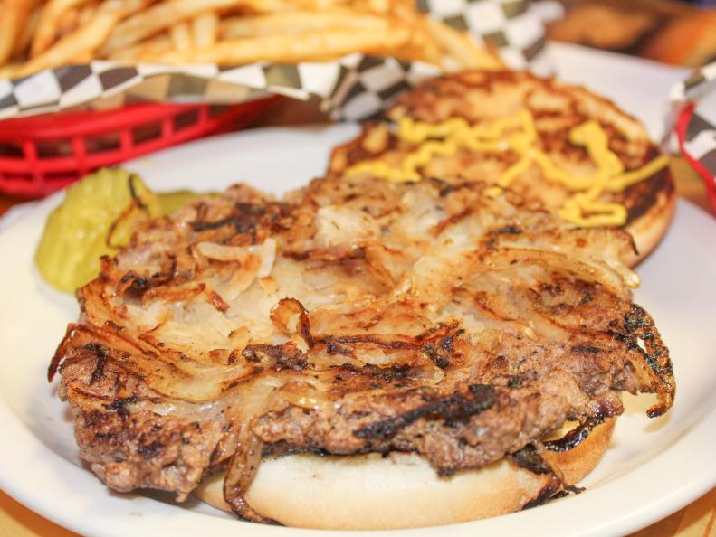 Fried-onion burgers are popular statewide, but were born in El Reno during the Depression. Hamburger Inn owners H.W. Davis, Ross Davis and E.C. Cannon pressed a five-cent meat patty into a mound of shredded onions over a hot griddle, using the back of a heavy-duty spatula to make the burger look bigger. Turns out caramelized onions with charred edges make a burger so good that folks still line up for them daily at three places in El Reno: Robert’s Grill, Sid’s Diner and Johnnie’s Grill. The combo has also sparked an annual festival where they make one the size of a flying saucer.
