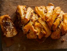 This sticky, crunchy and gooey pull-apart bread is perfect for a crowd. Pumpkin pie spice, caramel and pecans combine to make it your new fall favorite.