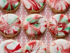 The fun in this recipe is preparing the marbled icing: Release your inner abstract artist as you drizzle red and green icing across a canvas of white on a baking sheet. Instead of dipping cookies in a bowl or on a plate, the baking sheet allows you to marble many cookies at once — without the colors getting muddy.