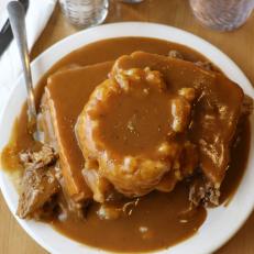 This South Dakota specialty is the ultimate sandwich for lovers of meat-and-potatoes meals. The open-face dish combines mashed potatoes and hearty chunks of seasoned roast beef sandwiched between two slices of white bread, all smothered in homemade gravy that can look like it's frightfully close to running over the edge of the plate. The dish is available at diners and cafeterias throughout the state — often, unfortunately, with instant potatoes. One of the top hot-beef destinations for locals who want the real deal, made from scratch, is the Wheel Inn Cafe, which has been serving the savory treat for more than half a century.