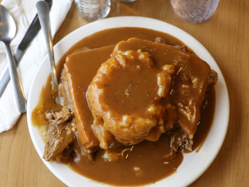 This South Dakota specialty is the ultimate sandwich for lovers of meat-and-potatoes meals. The open-face dish combines mashed potatoes and hearty chunks of seasoned roast beef sandwiched between two slices of white bread, all smothered in homemade gravy that can look like it's frightfully close to running over the edge of the plate. The dish is available at diners and cafeterias throughout the state — often, unfortunately, with instant potatoes. One of the top hot-beef destinations for locals who want the real deal, made from scratch, is the Wheel Inn Cafe, which has been serving the savory treat for more than half a century.