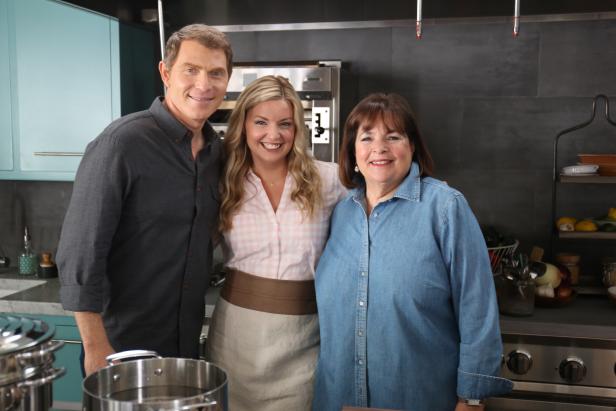 Hosts Bobby Flay and Damaris Phillips and guest Ina Garten smile and pose for the camera, as seen on Food Network’s Bobby and Damaris Show, Season1. 
