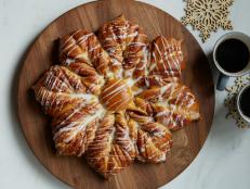 Bring your holiday guests together with this pretty, party-ready bread. Spiced raspberry jam peeks out through the sweet snowflake-shaped dough.