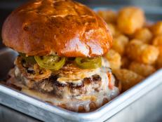 <p>Grab a truly great burger at this hip retro spot. Inspired by a favorite fast-food burger, owner Wes Rowe created The Hot Wes by stacking a magical combination of crisp onion rings and spicy pickled jalape&ntilde;os on a six-ounce patty smothered in gooey queso.</p>