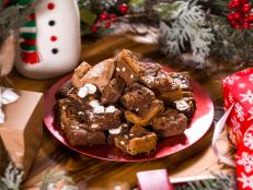 With a single recipe you can fill your holiday cookie plate with four different varieties of treats. All it takes is a few tubes of store-bought dough and some festive chocolate candies.