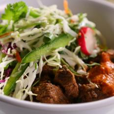 A bowl of Curry Beef from Biju's Little Curry Shop in Denver, CO, as seen on Food Network's Diners, Drive-Ins and Dives, Season 23.