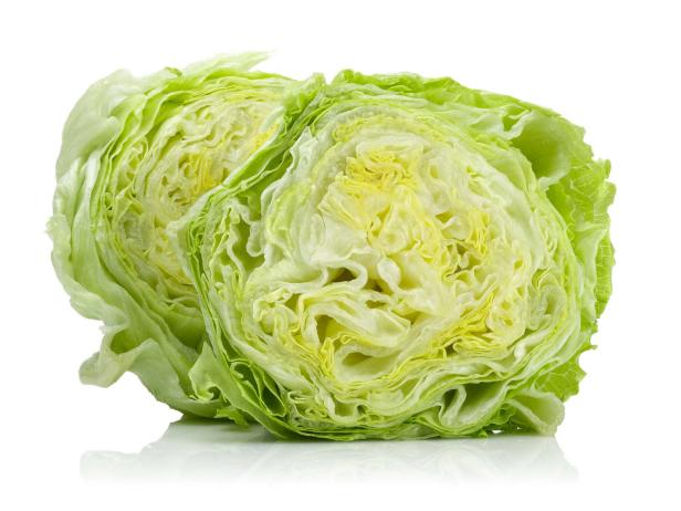 A head of iceberg lettuce, cut in half. Isolated on white.