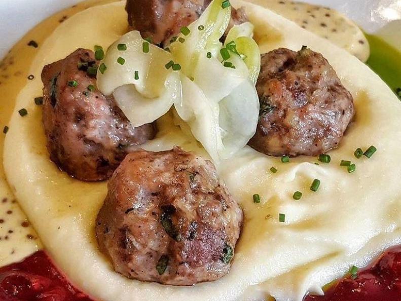 Minnesota has been home to Swedish immigrants for more than 150 years, and they've certainly left a mark on the state's food culture. Though many Scandinavian dishes have become iconic here in the north, few seem to have the pervasive reputation of Swedish meatballs. Fika, in the Swedish American Institute, has elevated the comforting spiced, cream-sauced meatballs to a new level. Perfectly seasoned with allspice, juniper and pepper, Fikaâ  s meat morsels are served with creamy mashed potatoes, sweet pickles and of course, the traditional partner to all respectable Nordic meatballs, lingonberries.