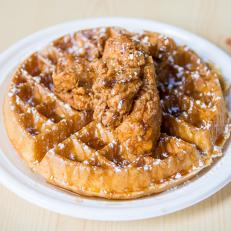 Launched in 2016, Connie’s Chicken & Waffles is a relative newcomer to Baltimore’s famed Lexington Market, but its fried chicken and waffles have generated a following to rival longtime mainstays like Berger’s Bakery and Faidley’s Seafood. There’s also a second, larger branch inside downtown’s Charles Plaza Eatery, where you’re likely to see owners Khari and Shawn Parker cooking alongside the restaurant’s namesake, their mom, Connie. Together, the siblings are sharing one of their all-time childhood favorites: succulent chicken tenders piled atop a soft buttermilk waffle dusted in powdered sugar and maple syrup. Mom should be proud.