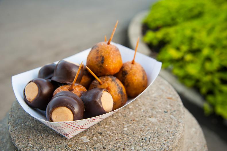 Ohio’s Buckeye State nickname is inspired by the state tree: the buckeye. The tree produces buckeye nuts, and though they’re inedible, they’ve inspired a namesake treat that’s made in chocolate shops and home kitchens statewide. To mimic the appearance of a buckeye nut, the confection’s peanut butter center is partially dipped in chocolate. And at the Ohio State Fair, this iconic treat gets the deep-fried treatment, thanks to the Bulk Candy Store. The buckeyes are battered, deep-fried, then drizzled with chocolate and sprinkled with powdered sugar. It has become such a popular treat that the vendor travels to other state fairs to spread the buckeye love. 