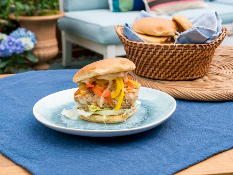 Co-hosts Jeff Mauro and Sunny Anderson's dish Grilled Mahi Mahi Sandwich with Escovitch and Mango Aioli, as seen on The Kitchen, Season 17.
